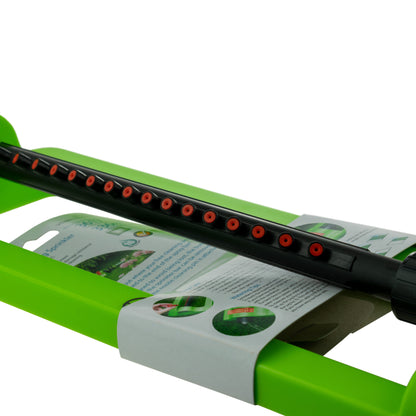 Oscillating sprinkler in green with black rotating bar and red spray holes