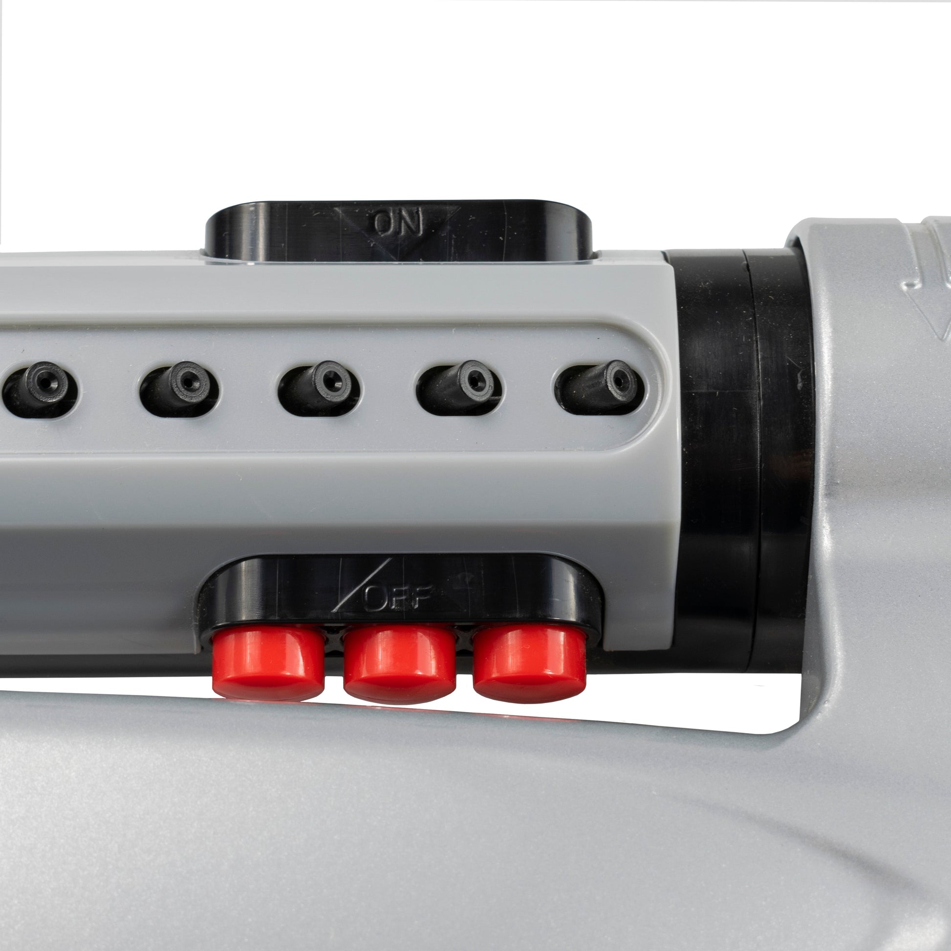Close-up of red control buttons on turbo oscillating sprinkler housing