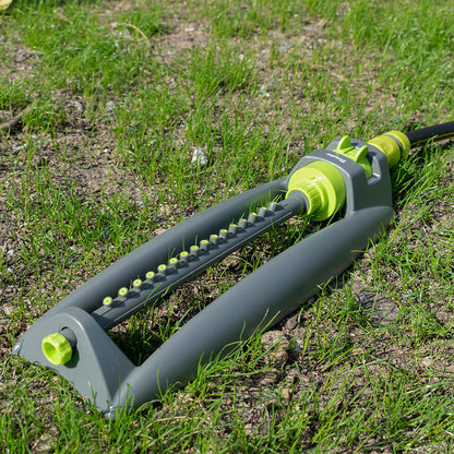 Oscillating bar sprinkler with lime-green valve control and grey spray bar