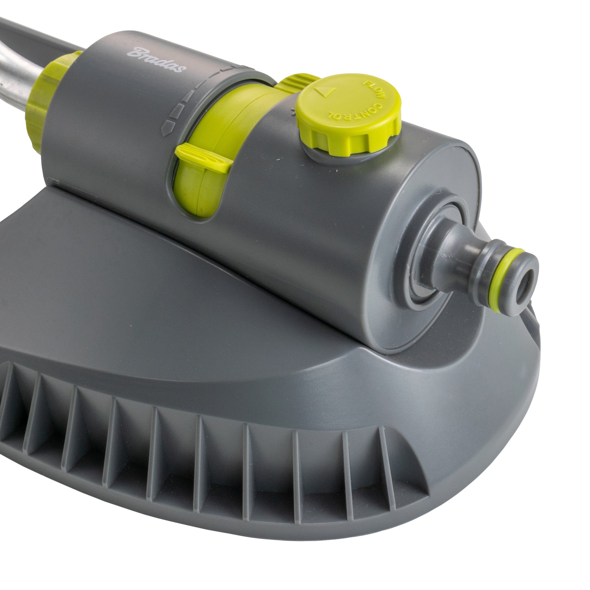 Close-up of gray sprinkler head with lime control cap and side hose outlet