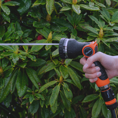 Black nozzle hose sprayer with fan spray; orange dial and hand grip