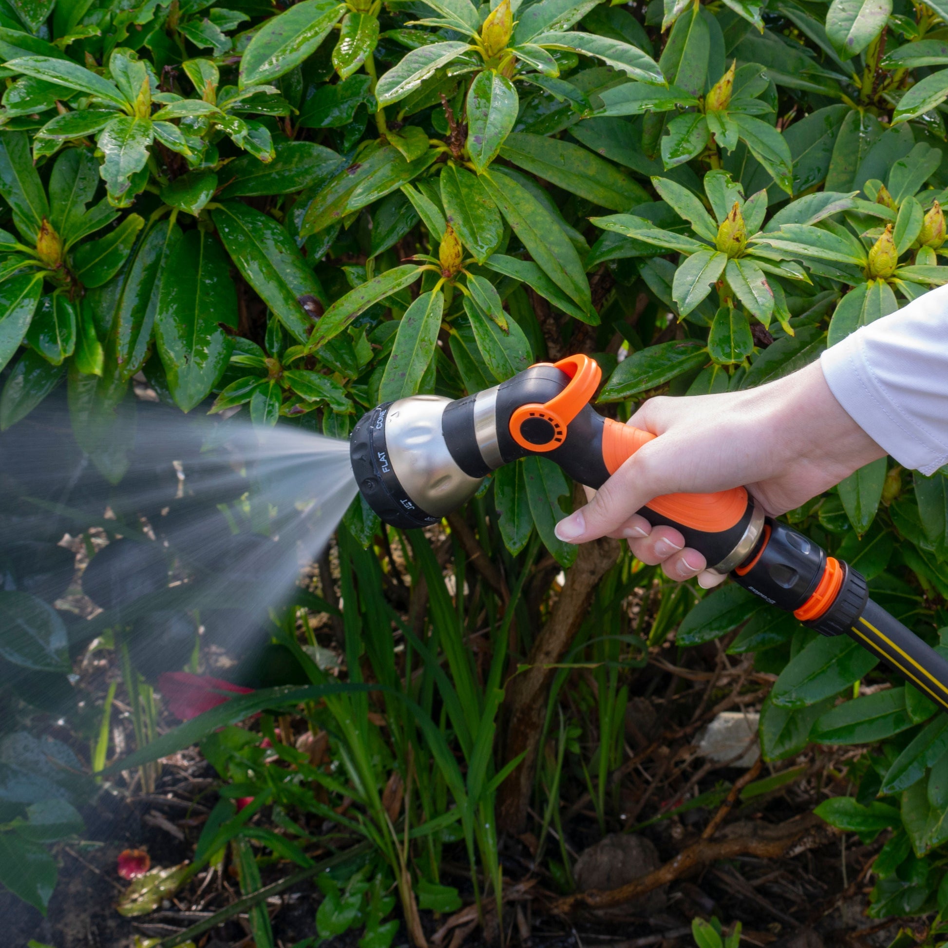Black and orange hose water sprayer with 8 settings, handheld trigger and spray stream