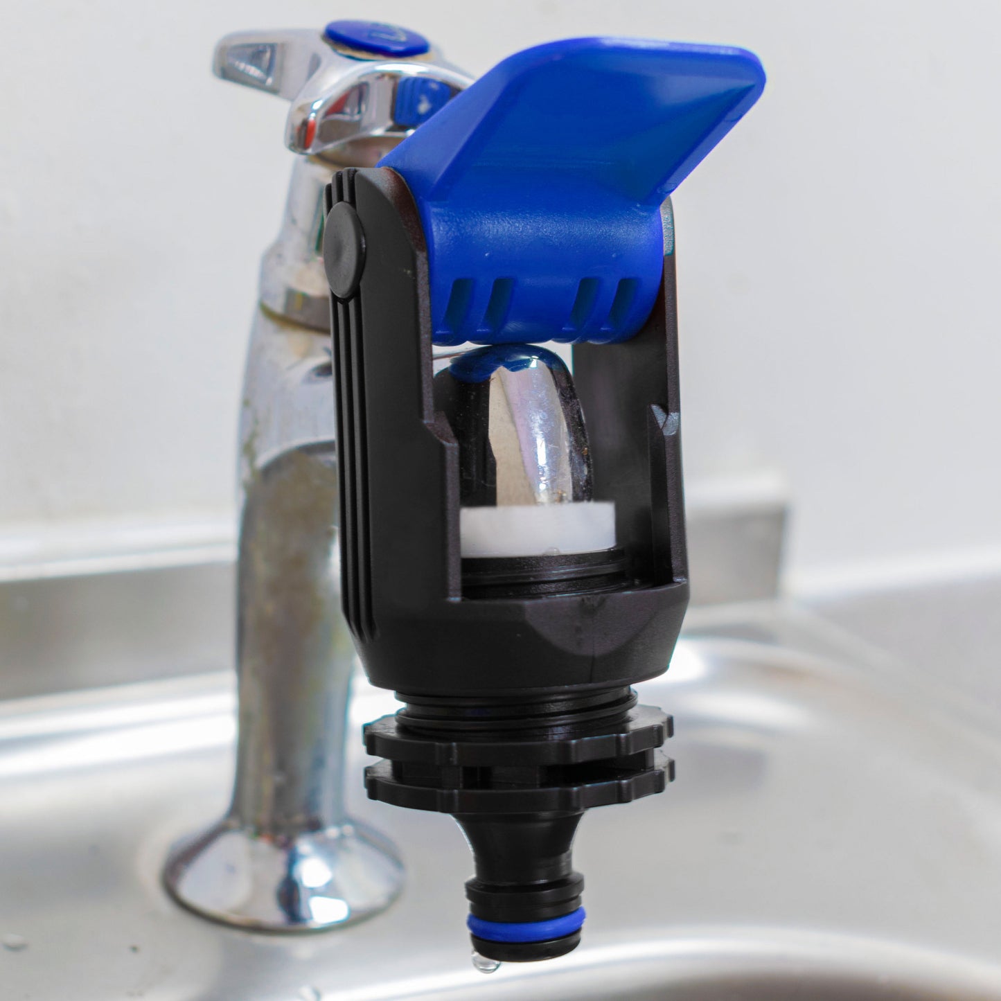 Blue kitchen tap adaptor with black grip sleeve and blue push button