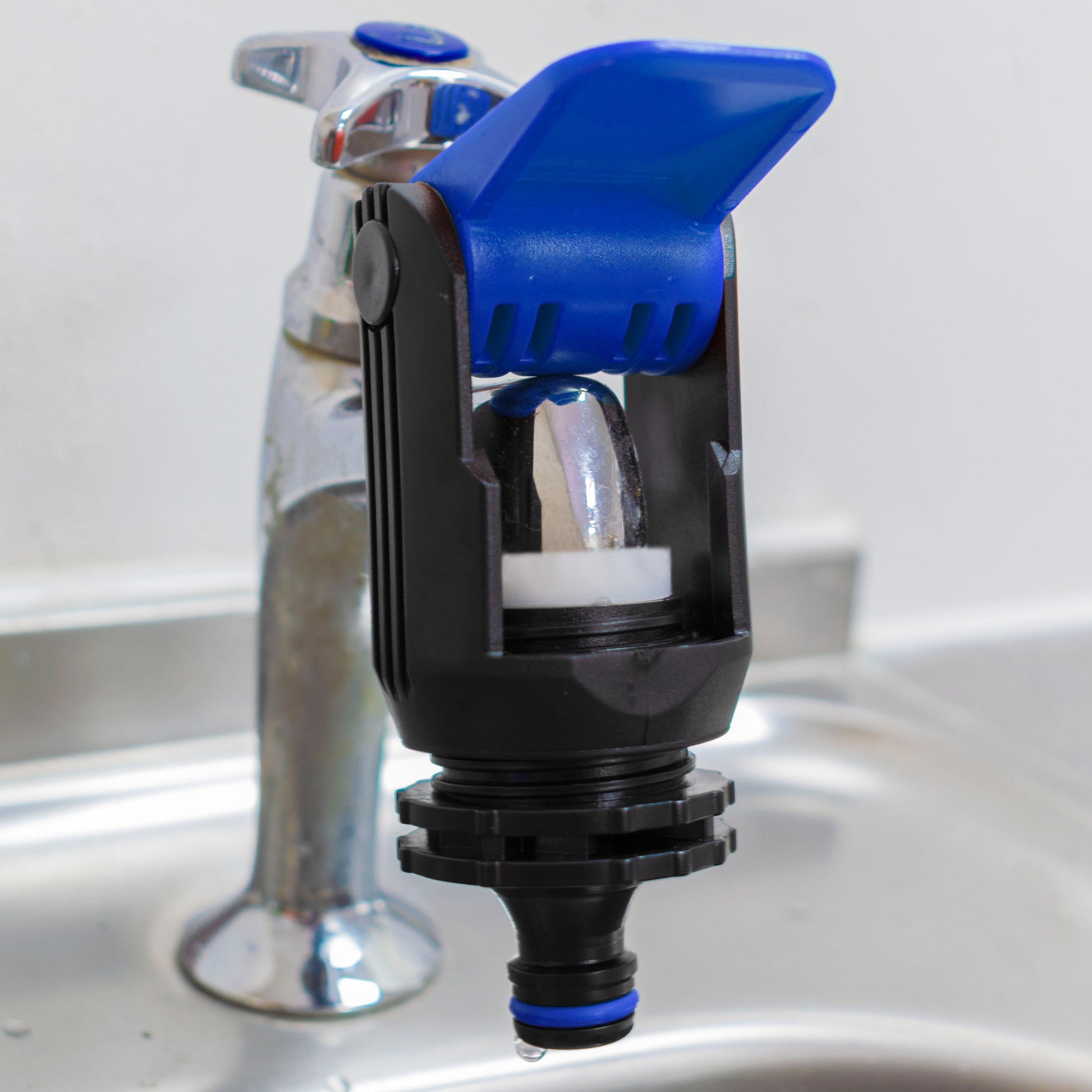 Blue kitchen tap adaptor with black grip sleeve and blue push button