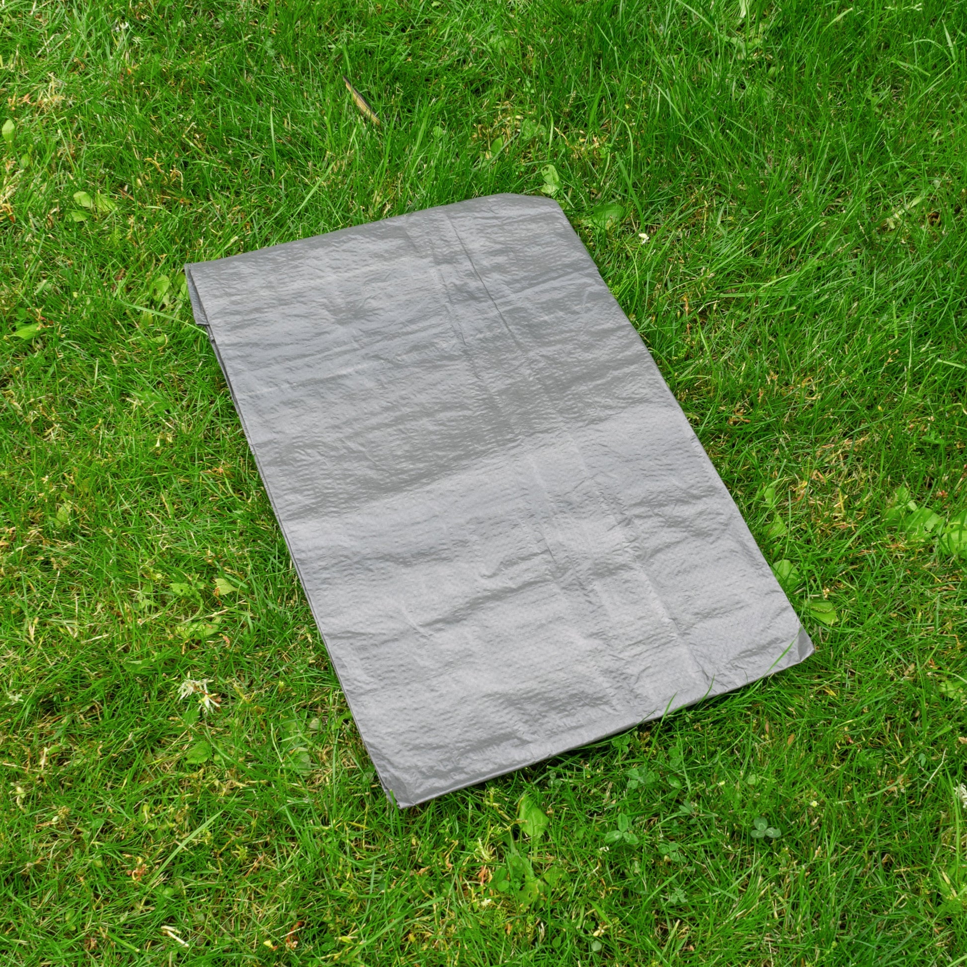 Gray tarpaulin 4m x 5m laid flat on grass