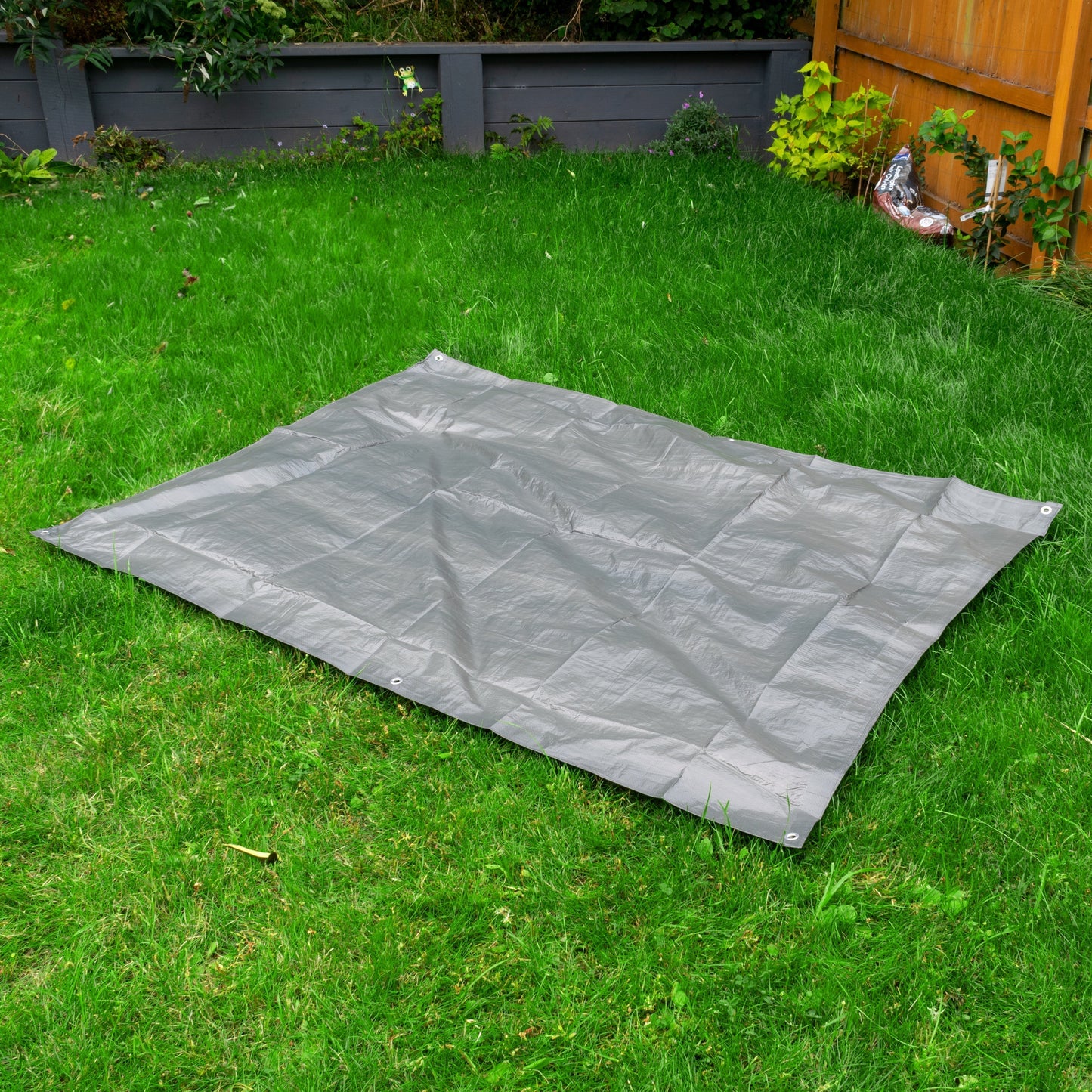 Gray tarpaulin 4m x 5m spread out with corner grommets
