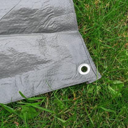 Gray tarpaulin corner with metal ring eyelet on the edge