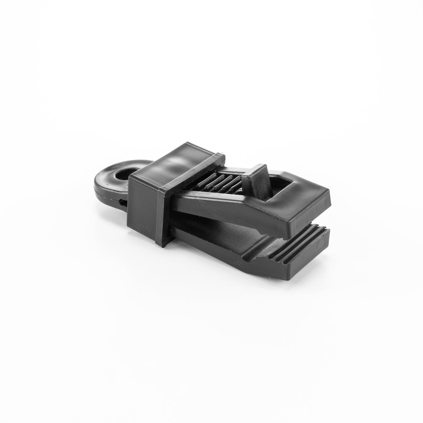Black slide tarp clip for securing tarpaulin, close-up
