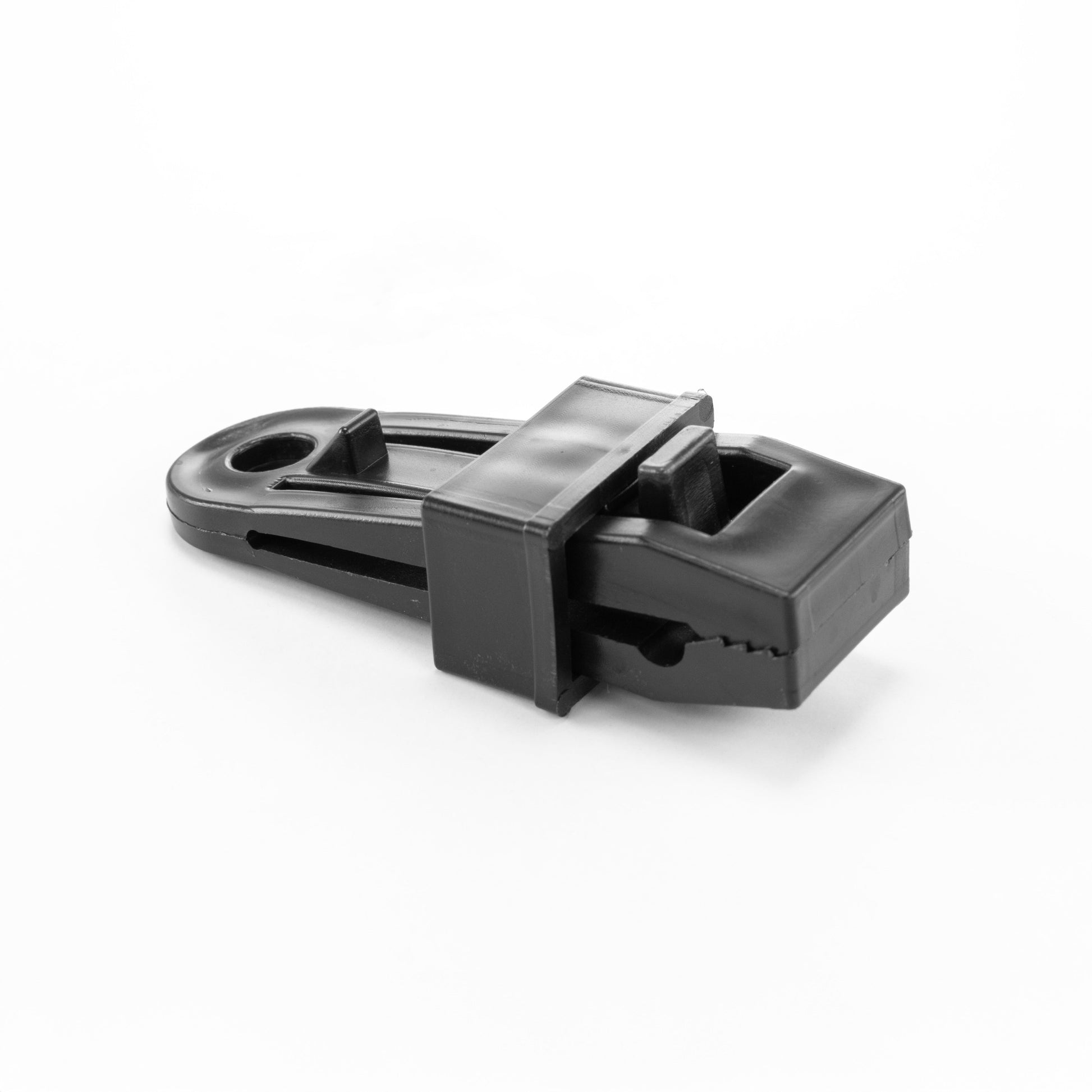 Black slide tarp clip with integrated latch and channel for securing tarpaulin