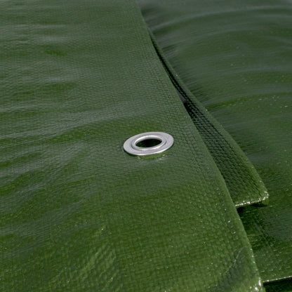 Close-up of green tarpaulin weave with round metal eyelet on reinforced seam
