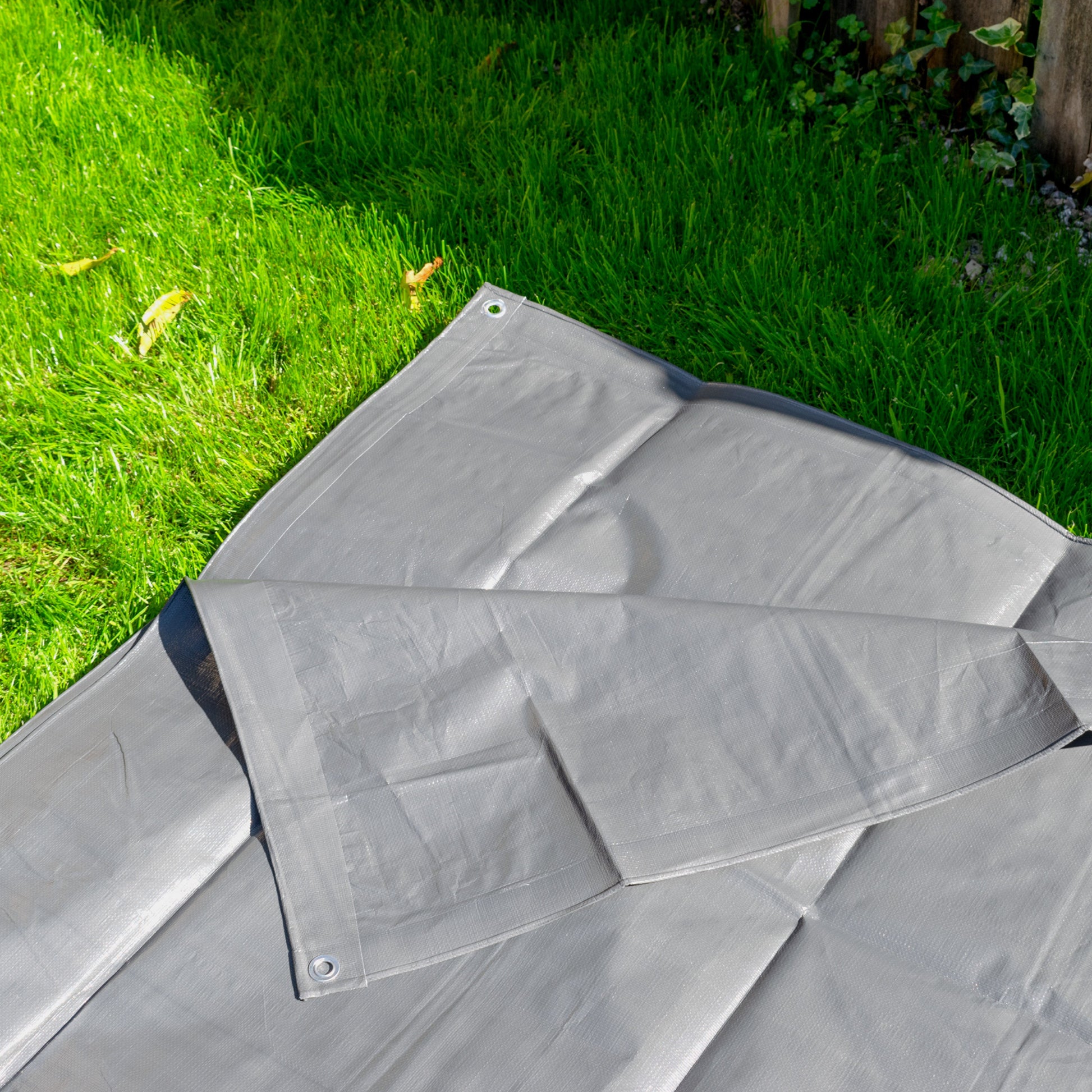 Grey tarpaulin 2m x 3m laid out, showing stitched seams and folds