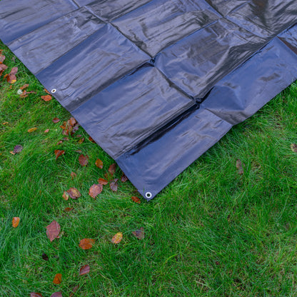Light blue tarp with stitched panels and grommet corner
