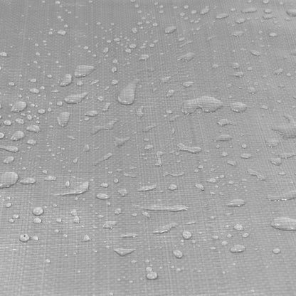 Silver tarpaulin fabric close-up with water droplets on textured surface