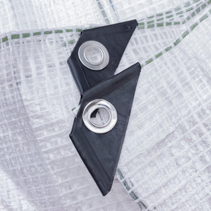 Clear tarpaulin corner details: black tabs with metal eyelets
