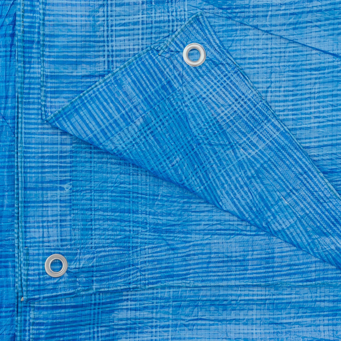 Blue tarpaulin 1.5m x 6m with reinforced grommets, woven grid texture