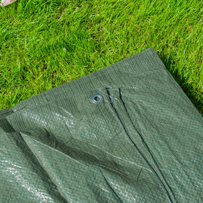 Green tarpaulin close-up of grommet and stitched seam along the edge