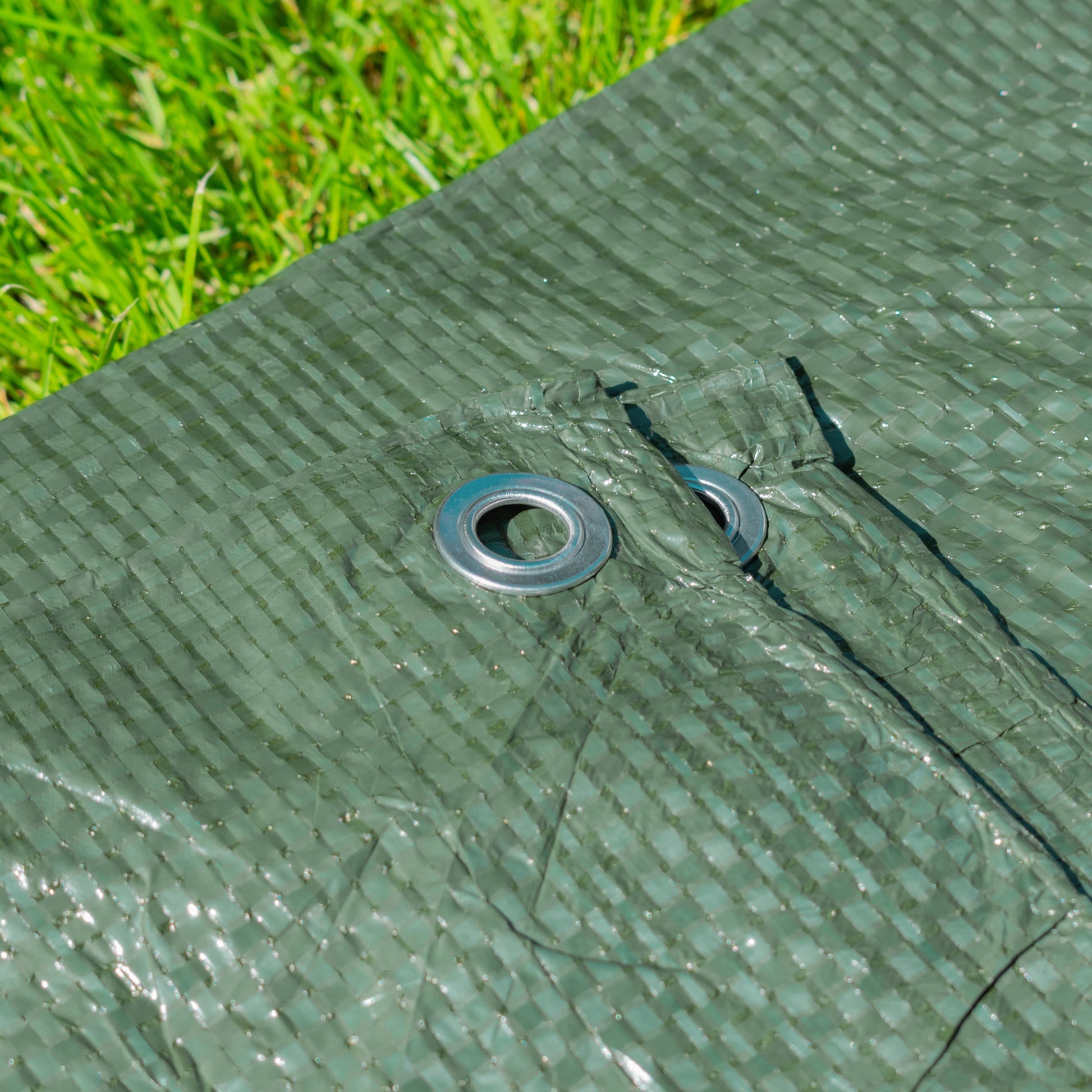 Green tarpaulin corner grommet with metal ring
