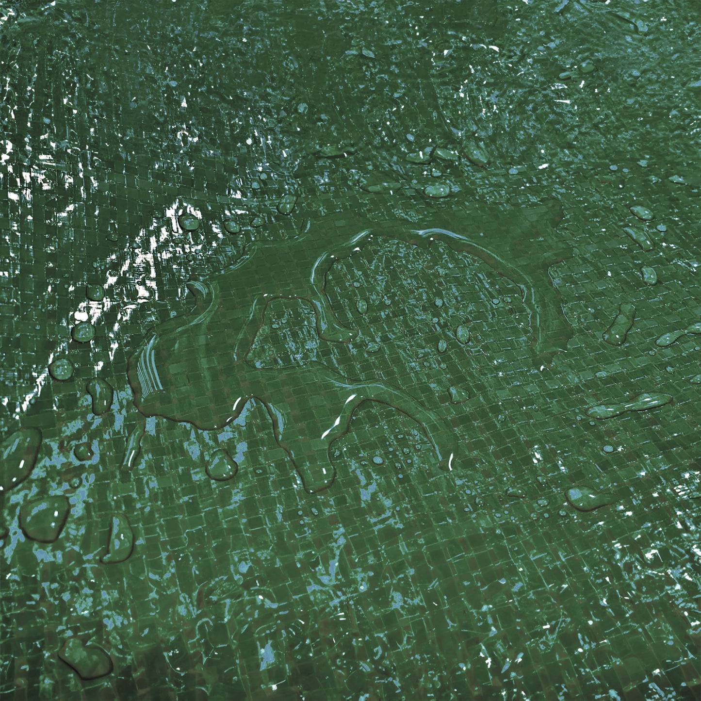 Green tarpaulin surface with water droplets on woven texture
