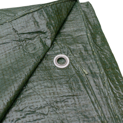 Green tarpaulin close-up of circular metal grommet on reinforced fabric