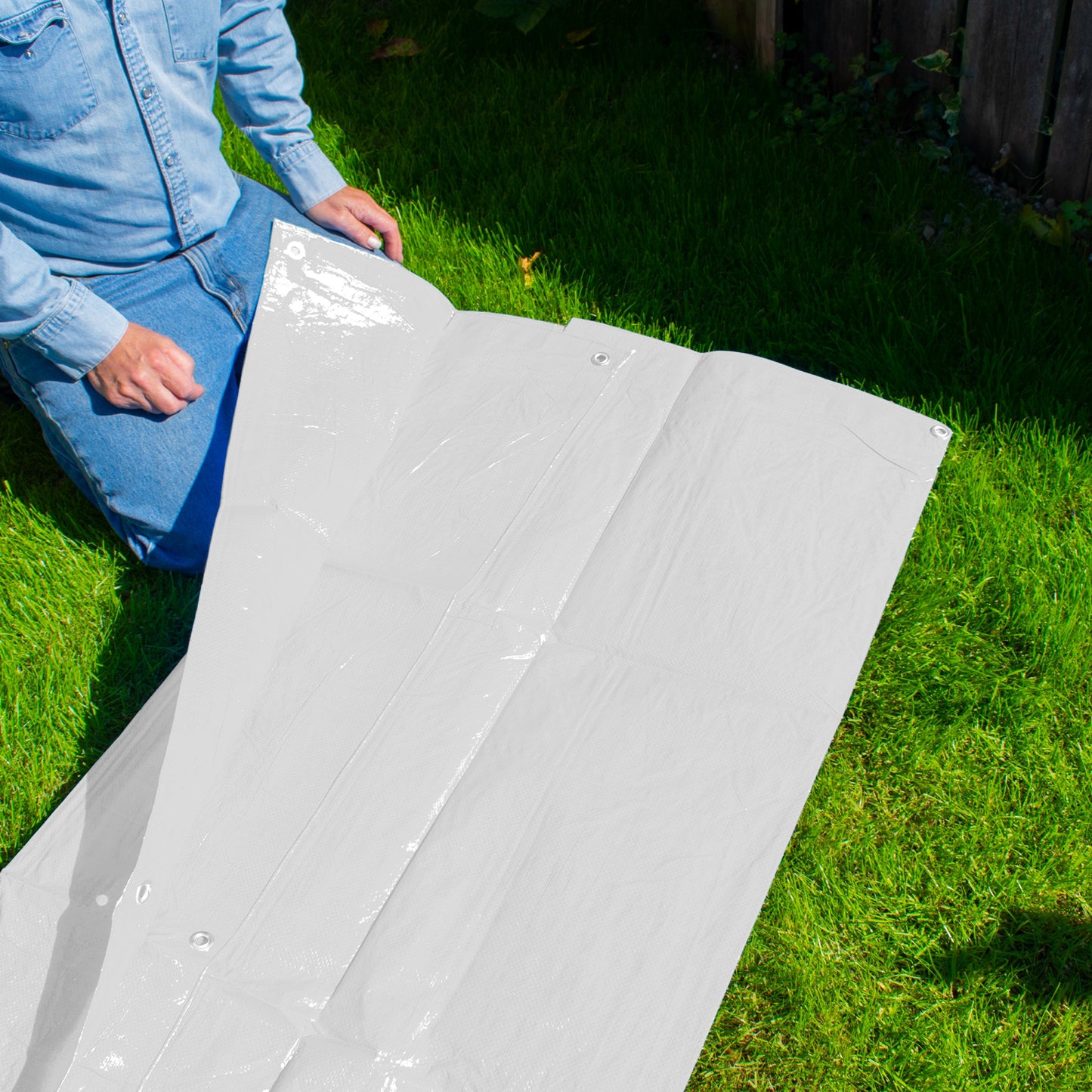 White tarpaulin sheet with grommets