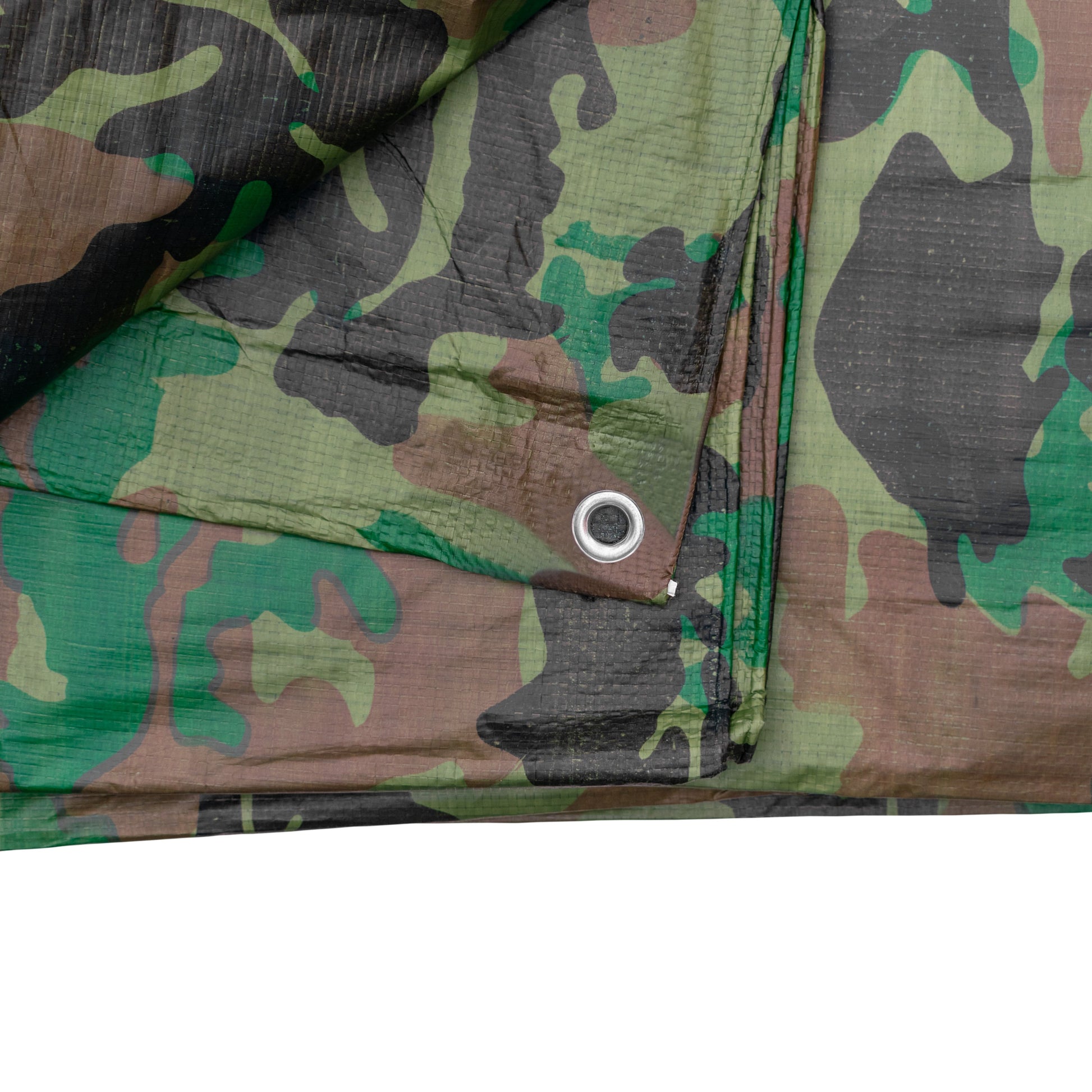 Camouflage tarpaulin seam with round metal grommet on corner