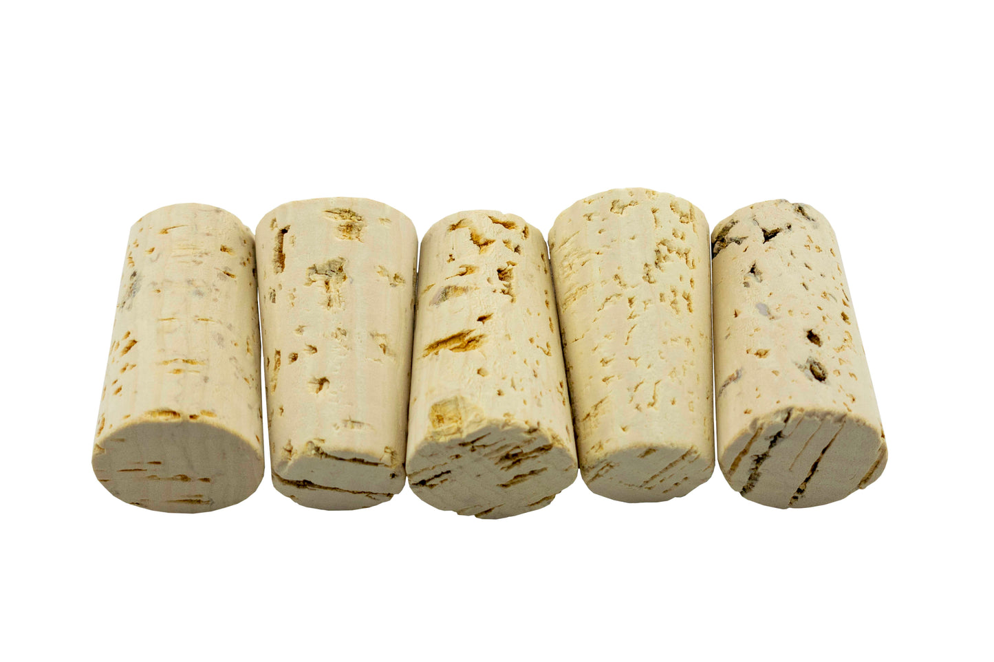 Tapered cork rolls close-up, off-white with brown marks