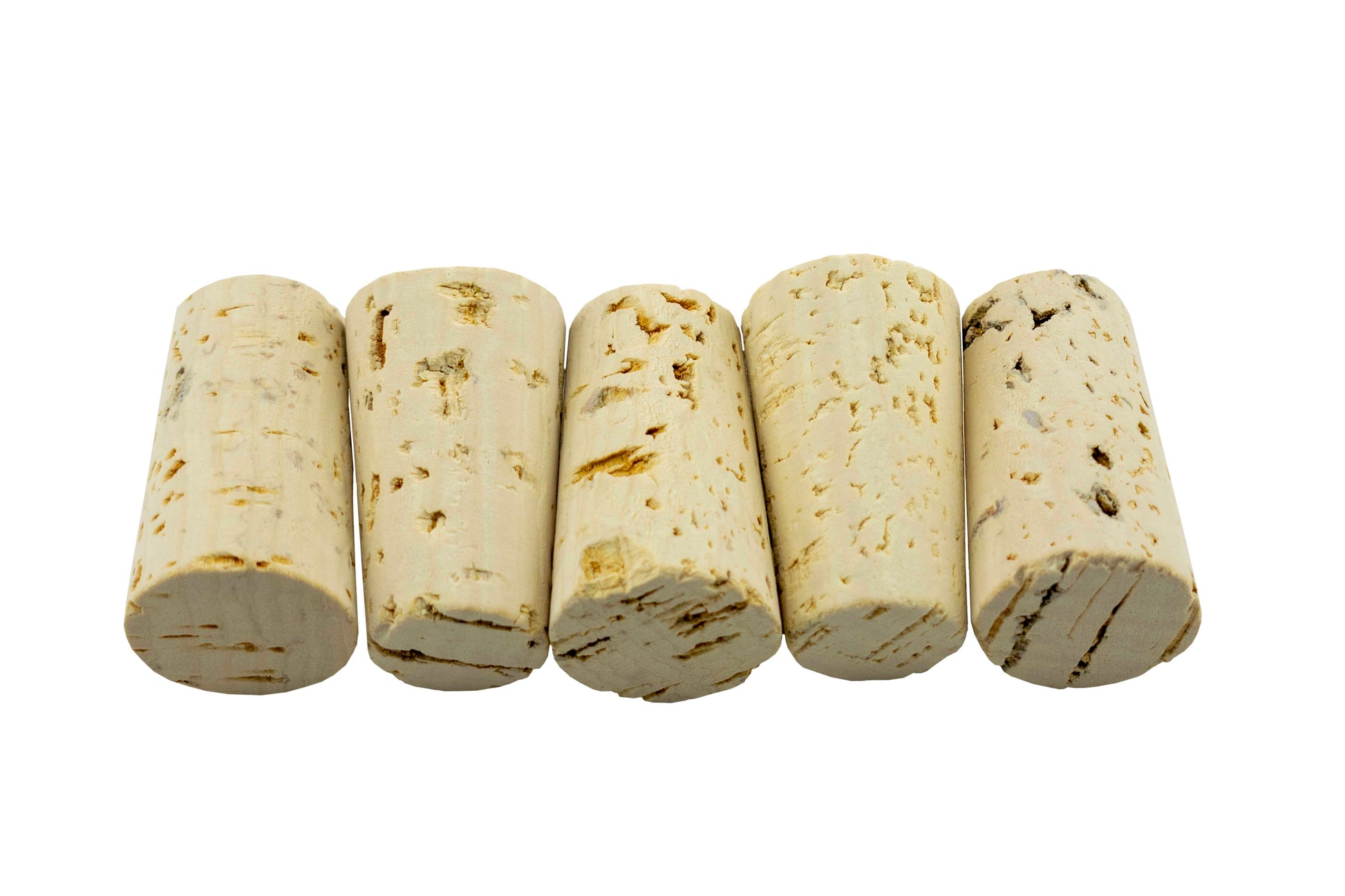 Tapered cork rolls close-up, off-white with brown marks