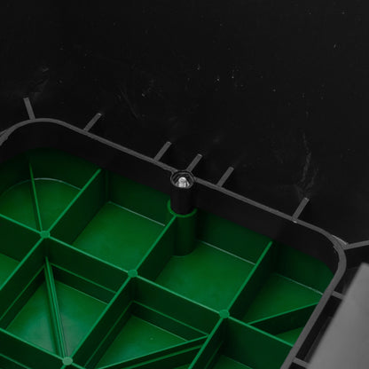 Close-up of green valve box grid and central fastening point inside black housing