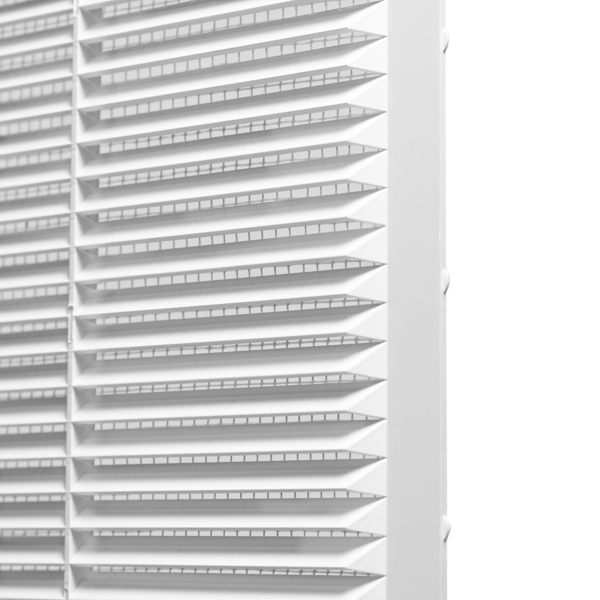 Side view of white louvre blades with fly screen mesh in the frame