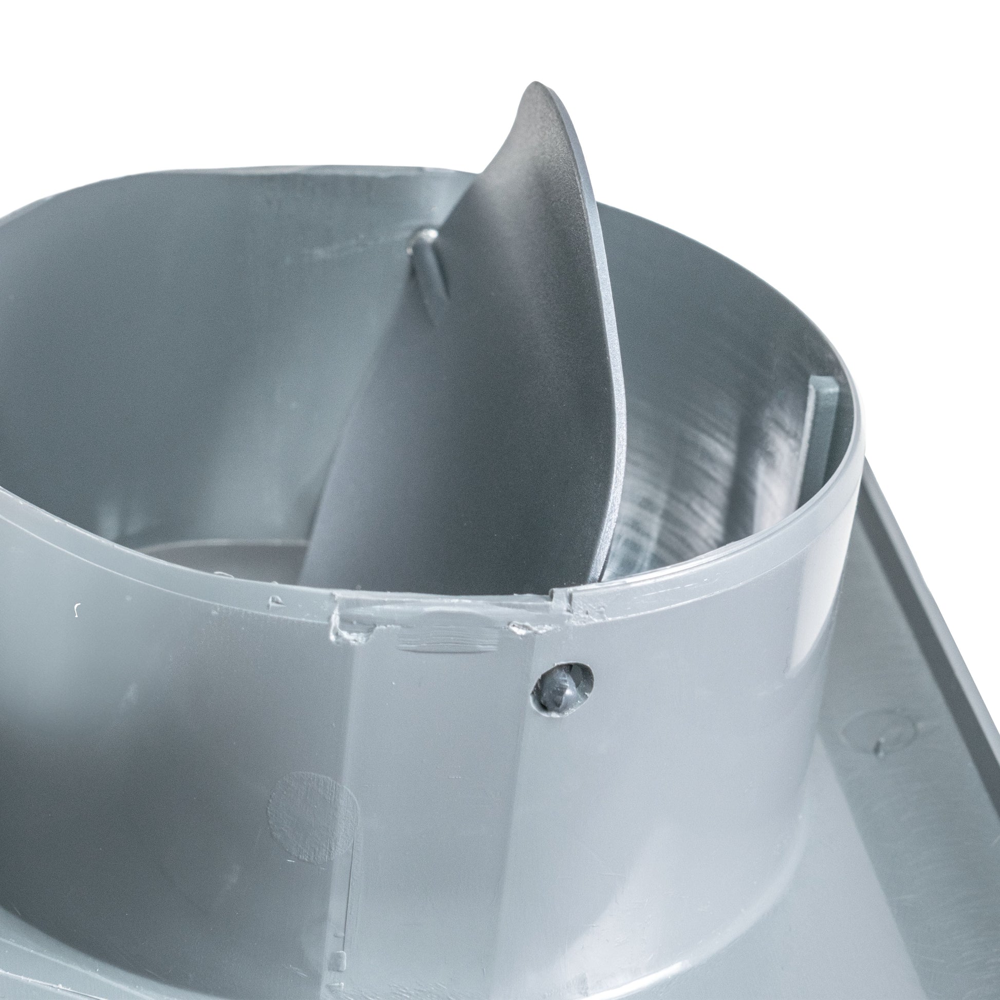 Close-up of duct connection: curved inner channel with metal screw fastener