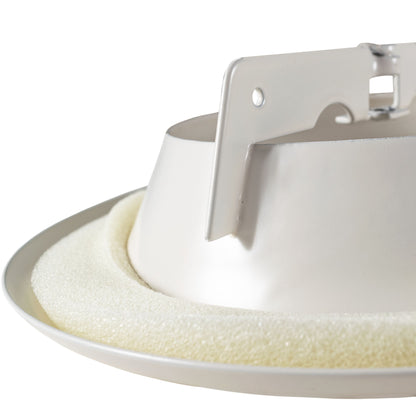 Close-up of internal parts: white damper plate and metal frame