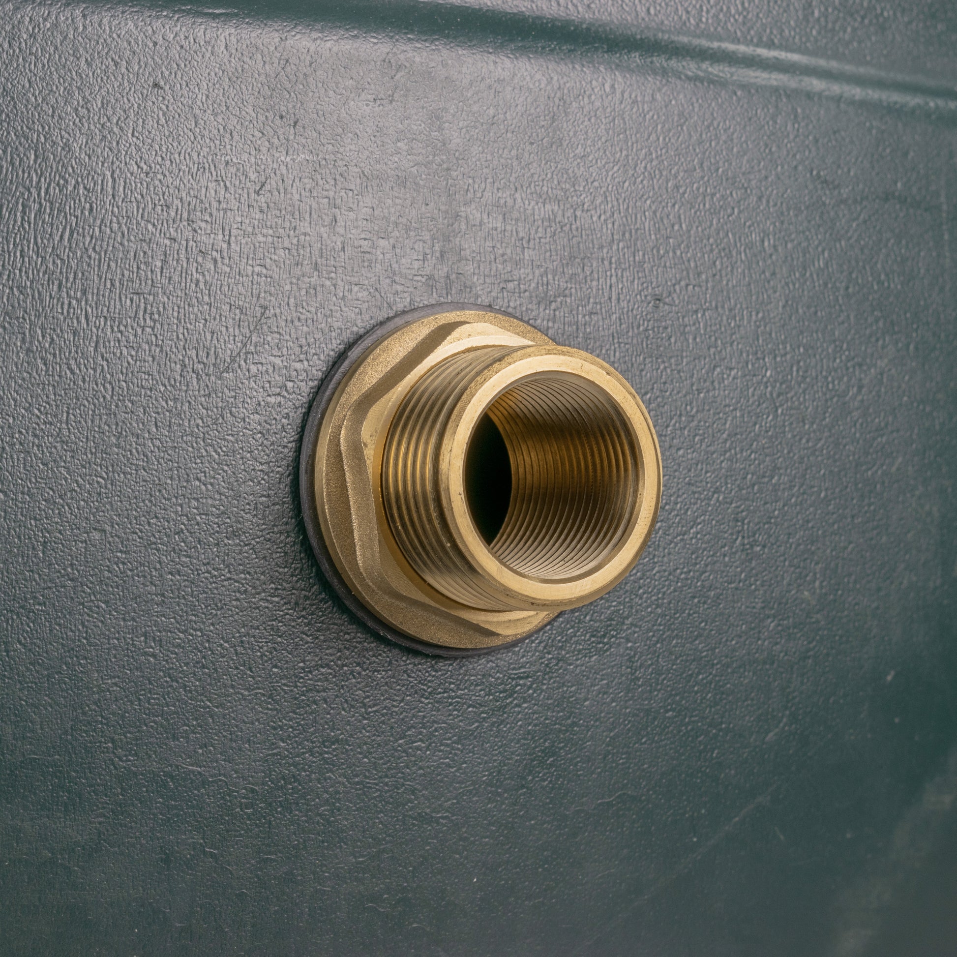 Brass threaded fitting with seal ring installed in a tank wall opening