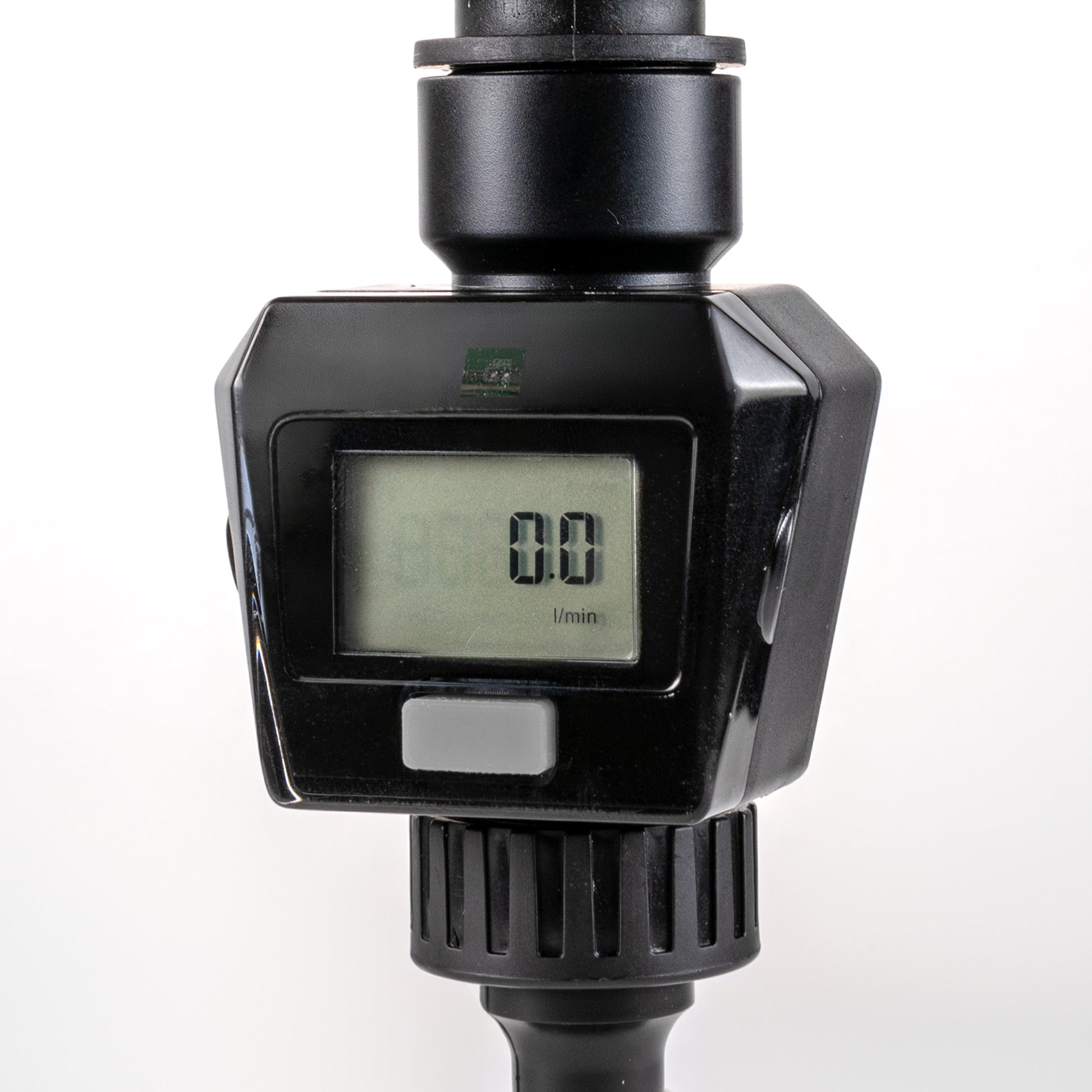 Water Flow Meter Gray, LCD showing 0.0 with “/min”, black housing and fittings