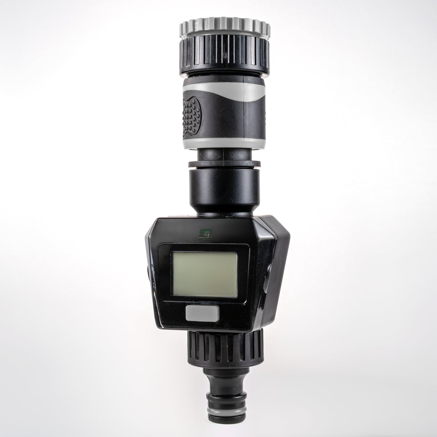 Gray water flow meter front view with LCD display and ribbed top fitting