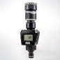 Gray water flow meter with LCD display, silver ribbed top, and inlet/outlet connectors