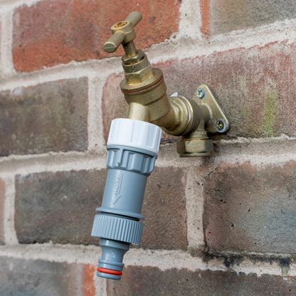 Female tap connector with pressure reducing valve, blue body with white cap and red ring, with brass inlet