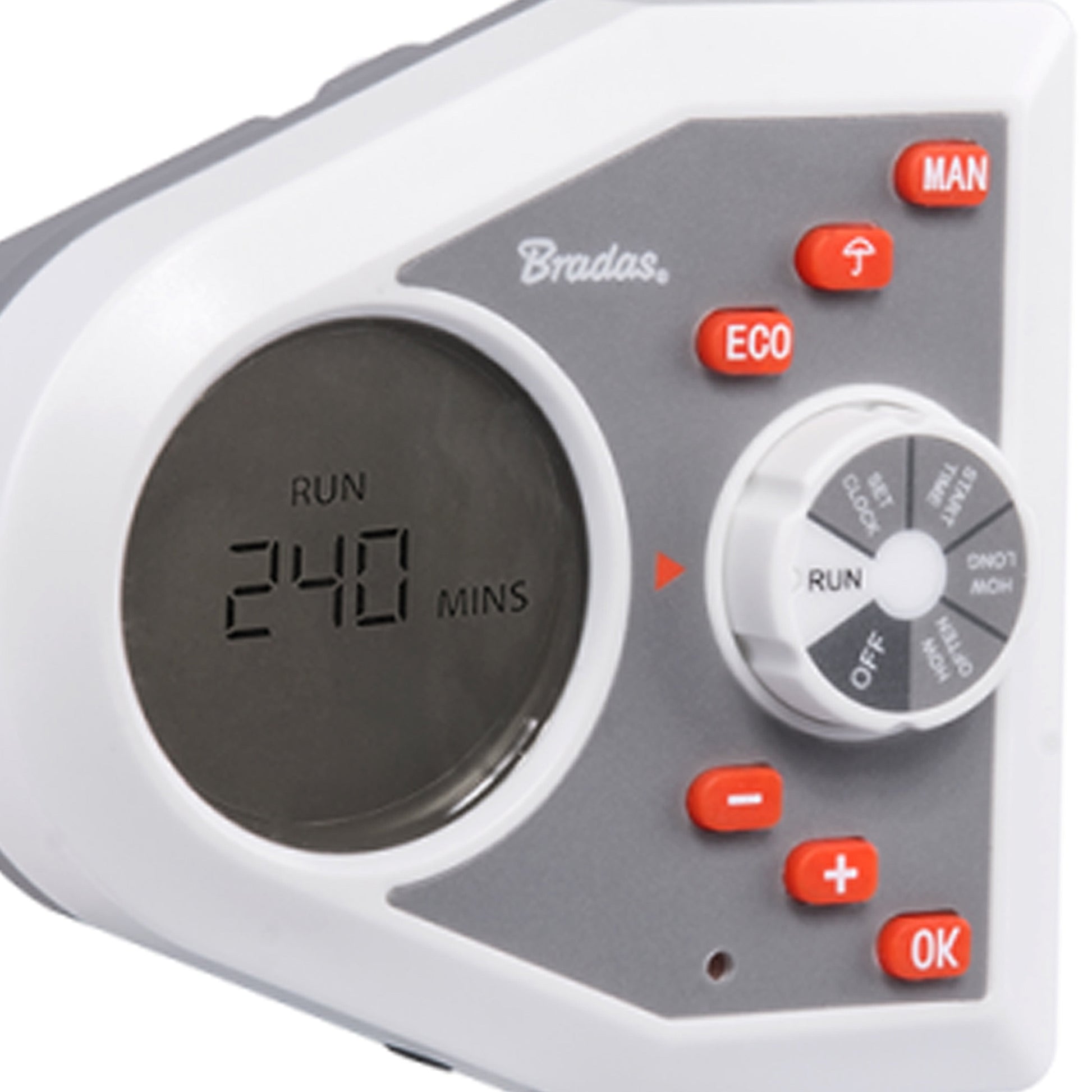 Close-up: white electronic water timer face with RUN minutes display and orange buttons