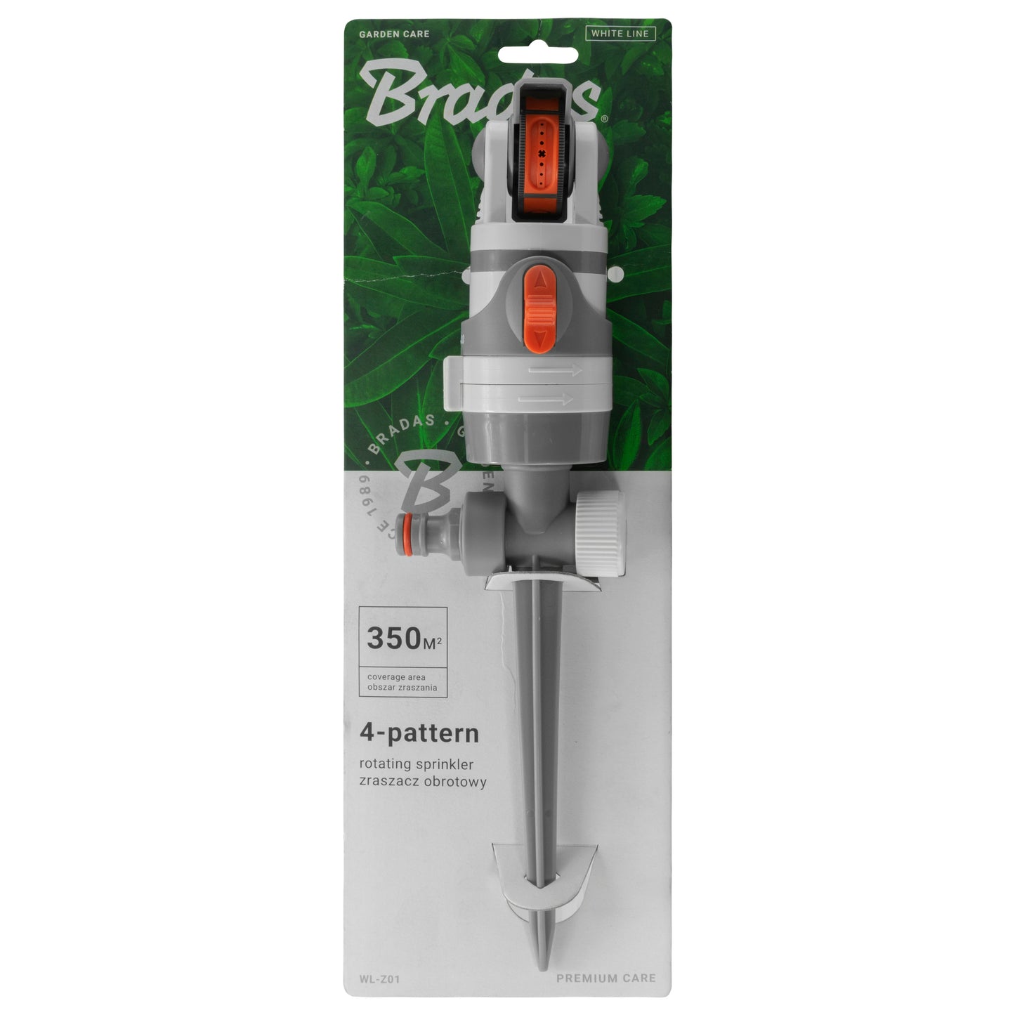 Sprinkler in retail package with gray and white body and orange dial
