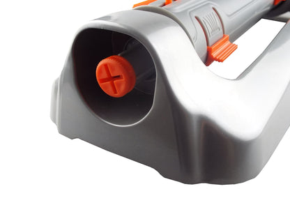 Close-up of sprinkler nozzle opening with orange cross-shaped selector