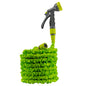 Lime expanding garden hose coiled with spray gun attached