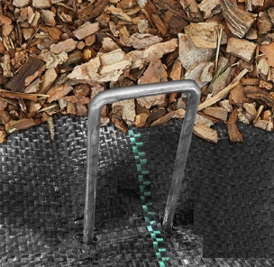 U-shaped galvanized hold-down staple securing weed mat to ground