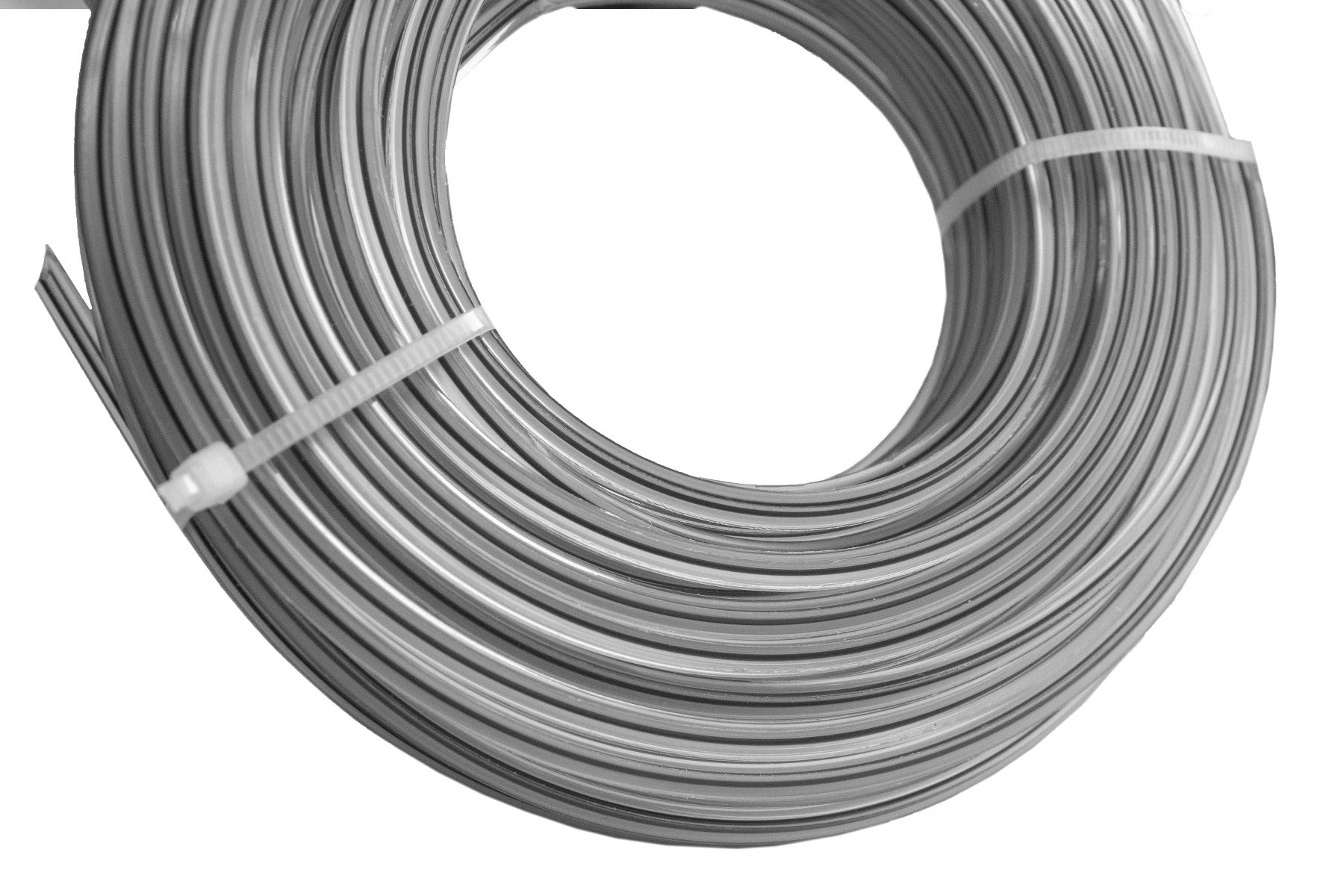 Close-up of Dual Star trimmer line coils in dark gray