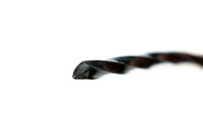 Close-up of black twisted strimmer line end, 3mm
