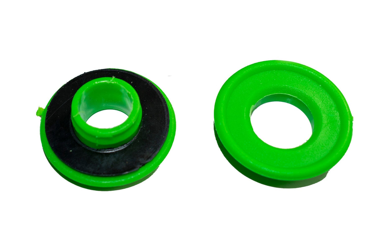 Green tarp grommets with recessed metal ring, close-up front view