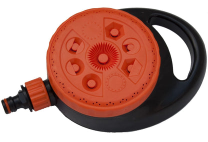 Orange sprinkler spray dial on a black base with side outlet and hose connector