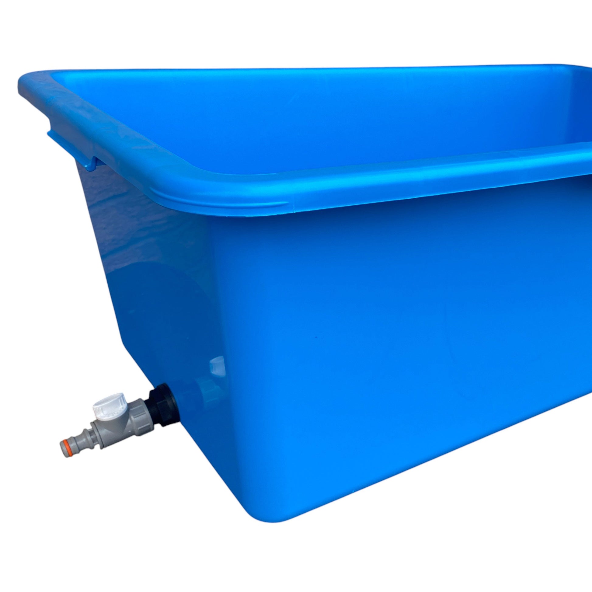 Blue dog bath showing side drain valve and connected outlet pipe on blue tub