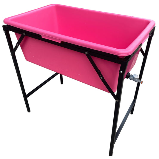 Pink dog bath with folding stand and black support frame