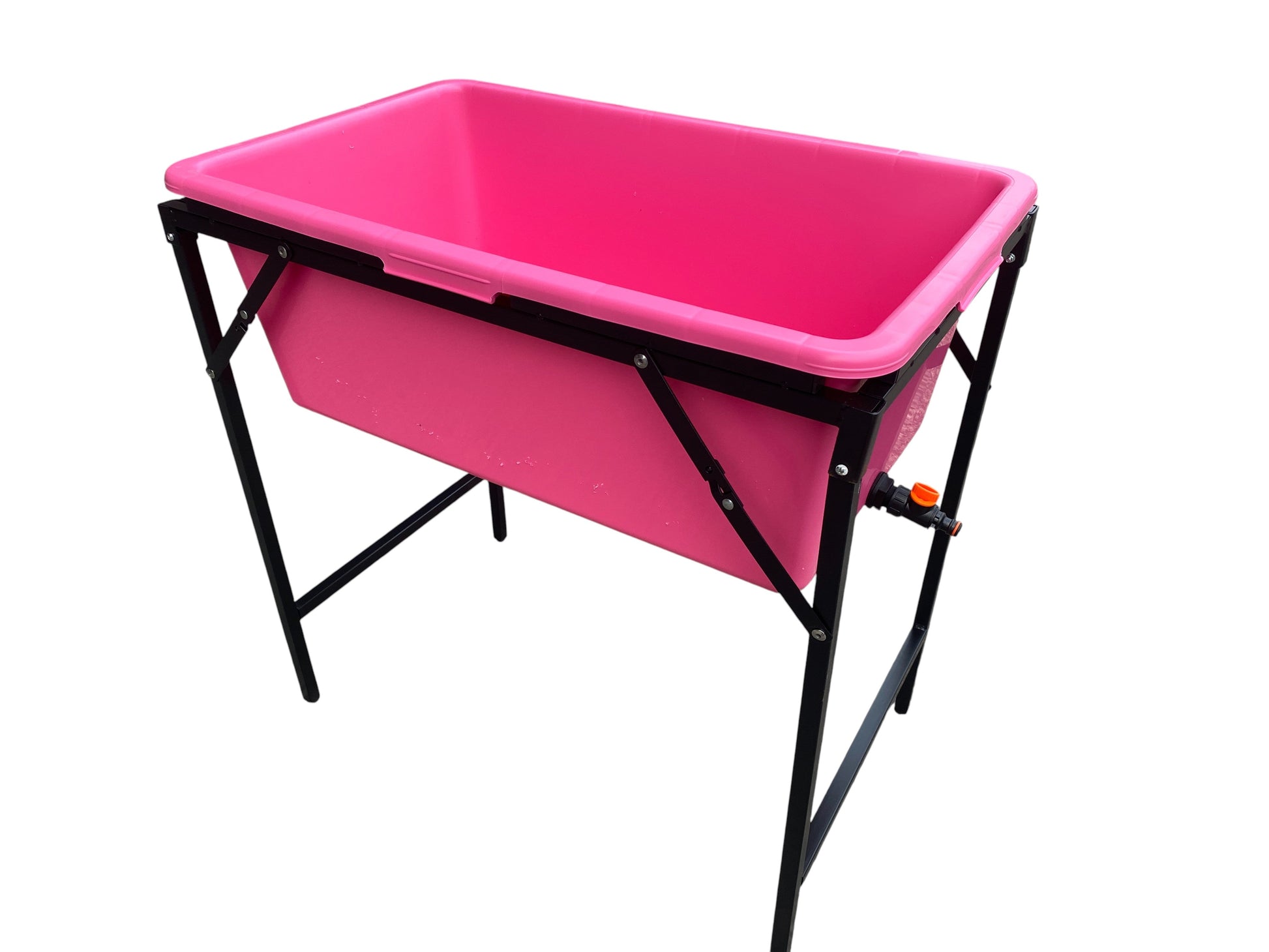 Pink dog bath on black folding stand with drain valve