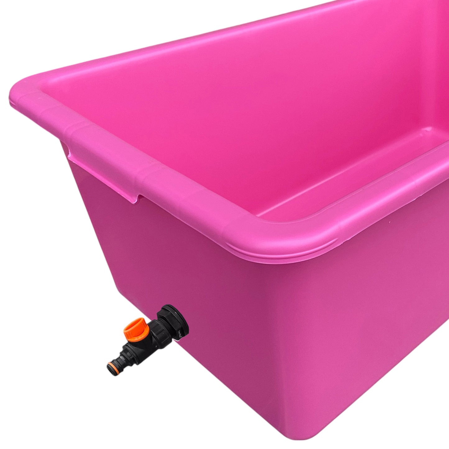 Pink dog bath with black drain valve and orange control tip