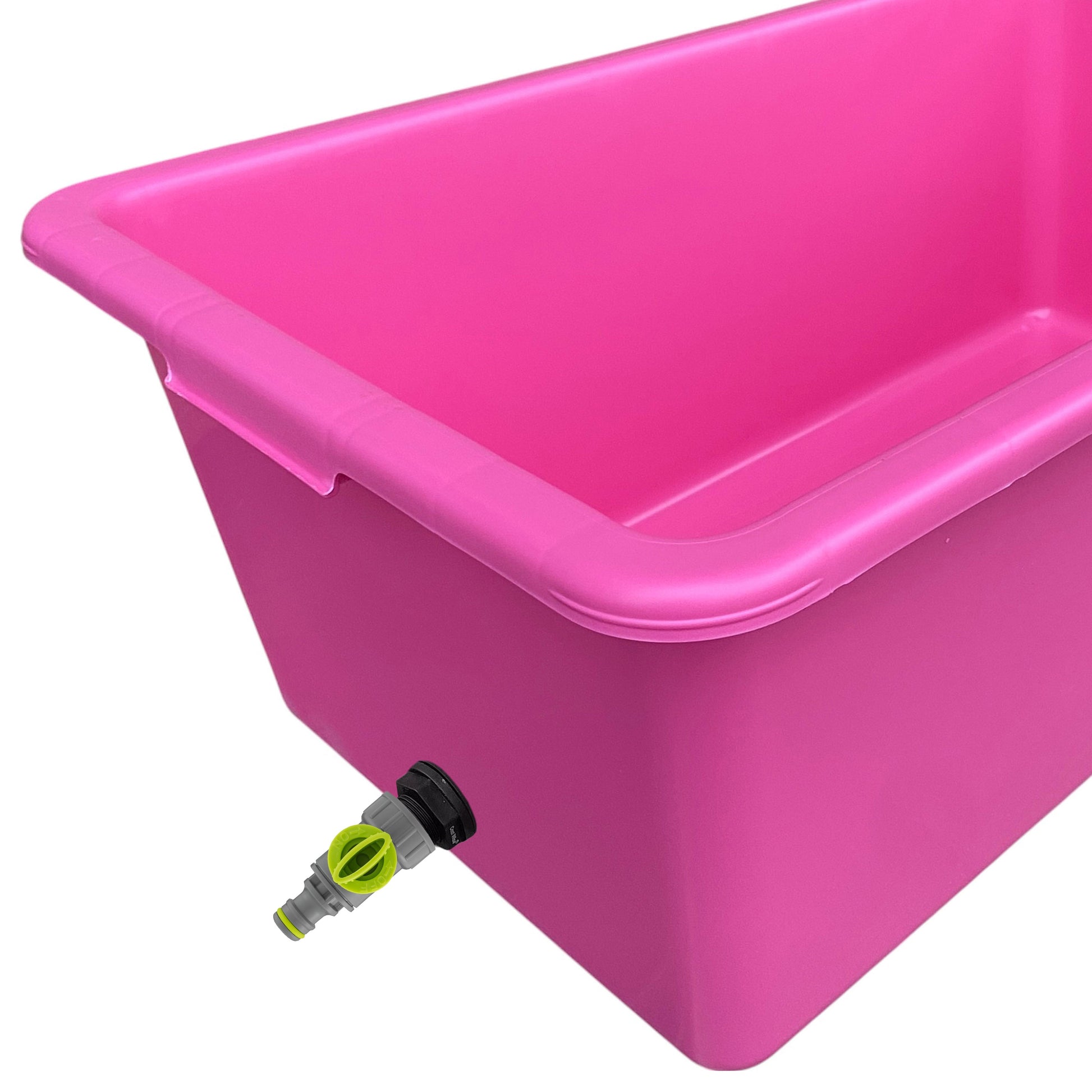 Pink dog bath tub with drain spout and lime valve detail